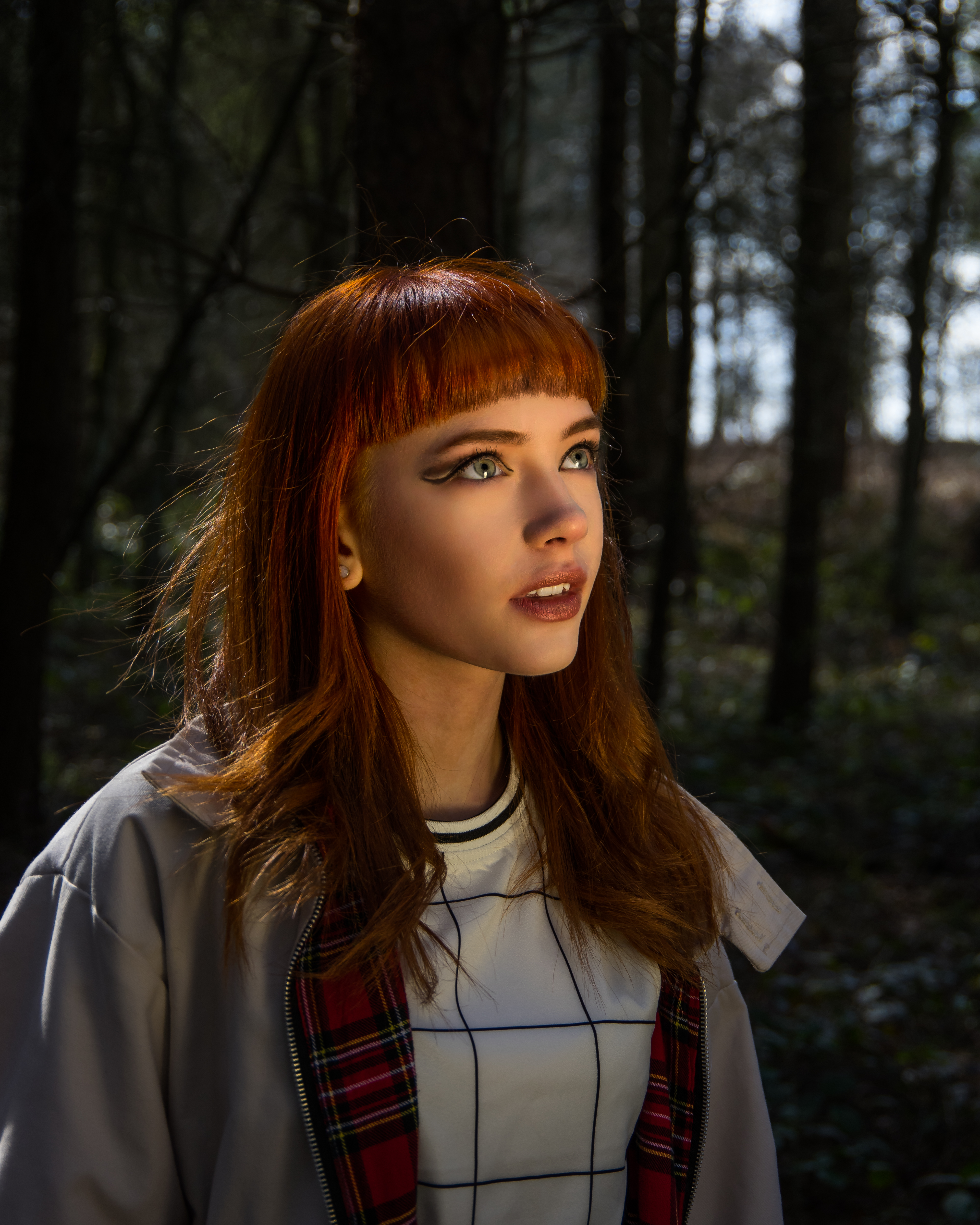 Yasmin Dawson in woodland, ethereal glow.